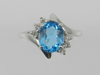 A 9 carat white gold, diamond and blue t