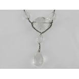 An unusual white metal and faceted rock crystal drop pendant necklace.