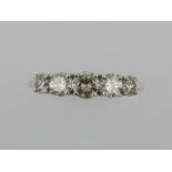 An 18 carat white gold and diamond ring, set five stones of approx. 1.04 carats combined.