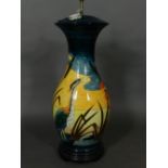 A large Moorcroft table lamp base, of baluster form and tube-lined decorated with stalk in