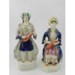 A pair of Staffordshire sultan figurines