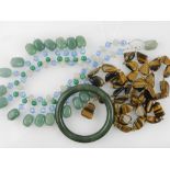 A green hard stone beaded necklace, toge