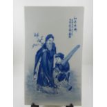 A Chinese blue and white porcelain plaque, painted with elderly man and child in landscape with