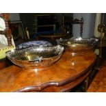 A pair of nickle plated reticulated fruit bowls.  H.12cm L.37cm