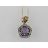 A fancy floral cut amethyst set pendant