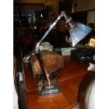 A chrome desk lamp, having adjustable head, raised on stepped square base, H.56cm