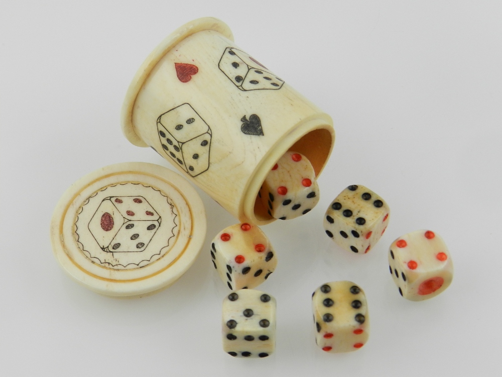 A novelty carved bone dice box, containi