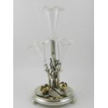 An unusual late 19th century silver plated urn, fitted four crimped glass receptacles, raised on