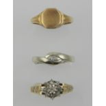A yellow metal and diamond set ring, the