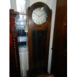 A 1920s German oak longcase clock.