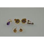 A pair of amethyst and yellow metal screw-back ear studs, marked 9ct; together with a pair of ear