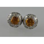 A pair of citrine earrings, mounted in a pierced white metal stamped 925.