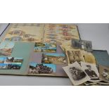 A quantity of early 20th century and later postcards, monochrome photographs etc, including first