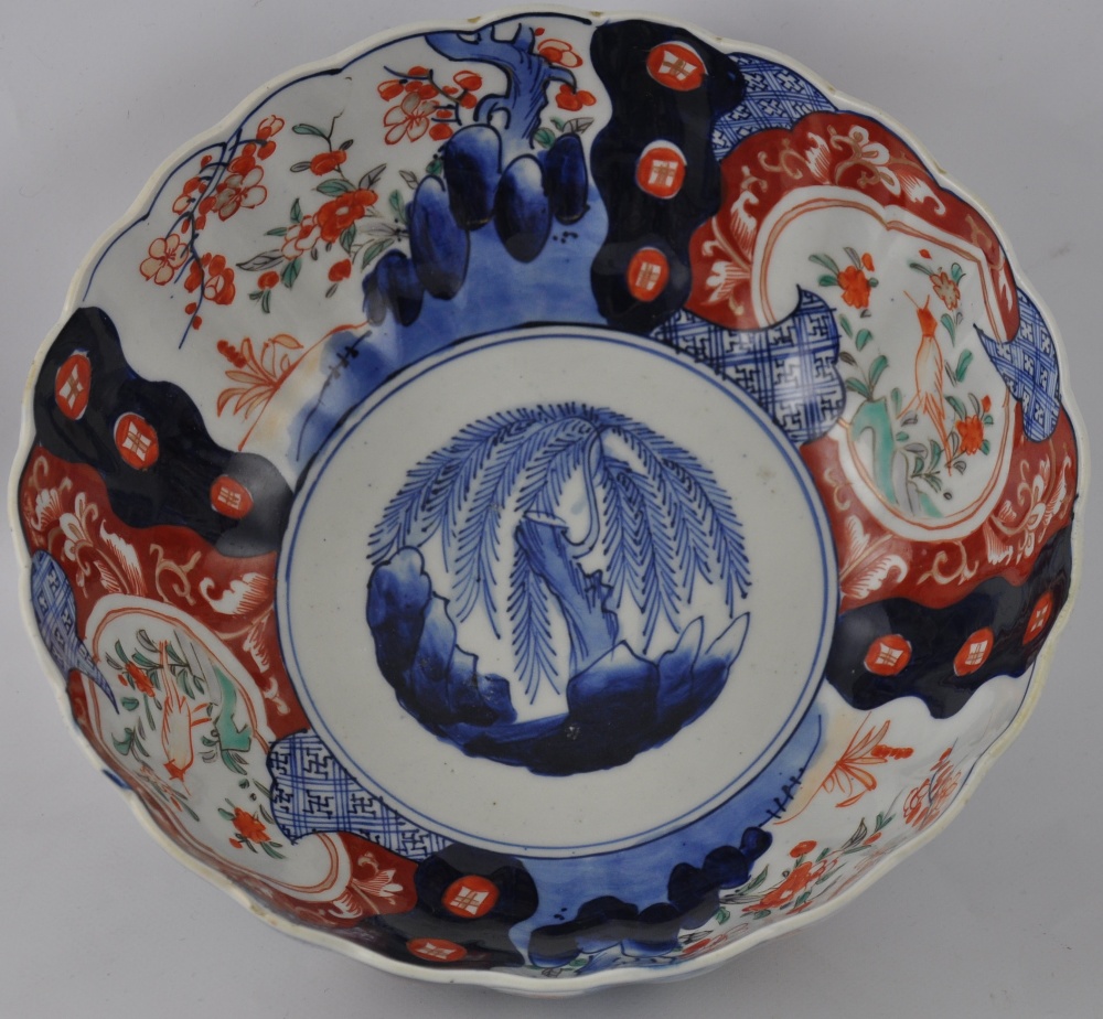 An early 20th century Imari bowl, the centre decorated with a willow, D. 25cm.