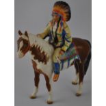 A Beswick Indian Chief mounted on a Skewbald horse, model no. 1391 'The Mounted Indian' designed by