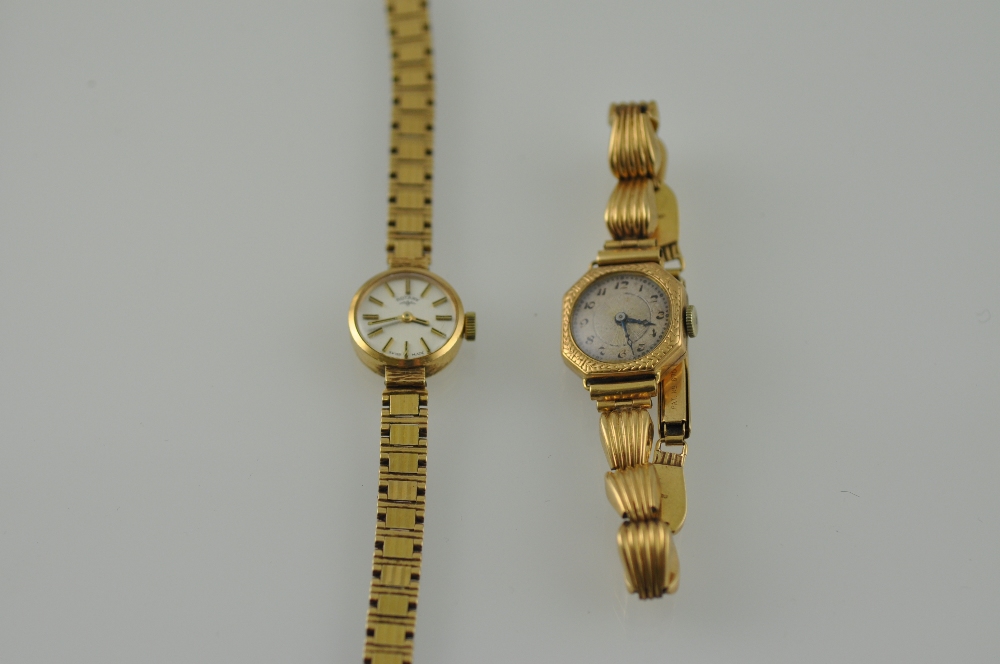 A ladies Rotary wristwatch, the dial with baton numerals on a yellow metal strap stamped 9ct,