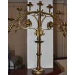 A pair of Victorian brass ecclesiastical candlesticks, the arched top rails supporting seven