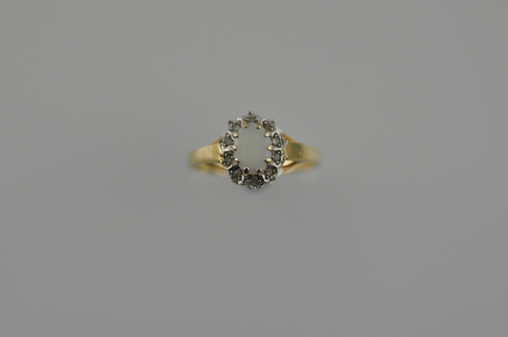 A 9ct gold opal and diamond dress ring, 2g.