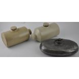 Two stoneware hotwater bottles, together with a similar pewter example, (3)