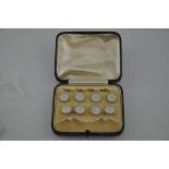 A set of shirt studs and cufflinks, mother-of-pearl set with pearls on yellow metal stamped 9ct,