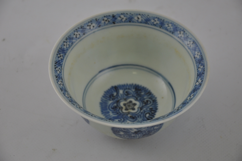 A blue and white rice bowl, decorated with foliate roundels, D. 12cm.