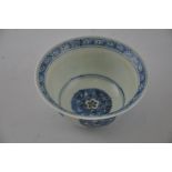 A blue and white rice bowl, decorated with foliate roundels, D. 12cm.