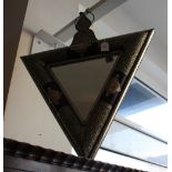 A Moroccan triangular wall mirror with finely pierced metal mounted frame.