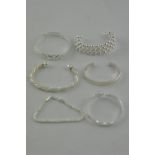 Six various white metal bracelets, total weight 99g.