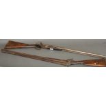 A late 19th century hammer action de-activated shotgun, with side-by-side barrels, walnut stock and