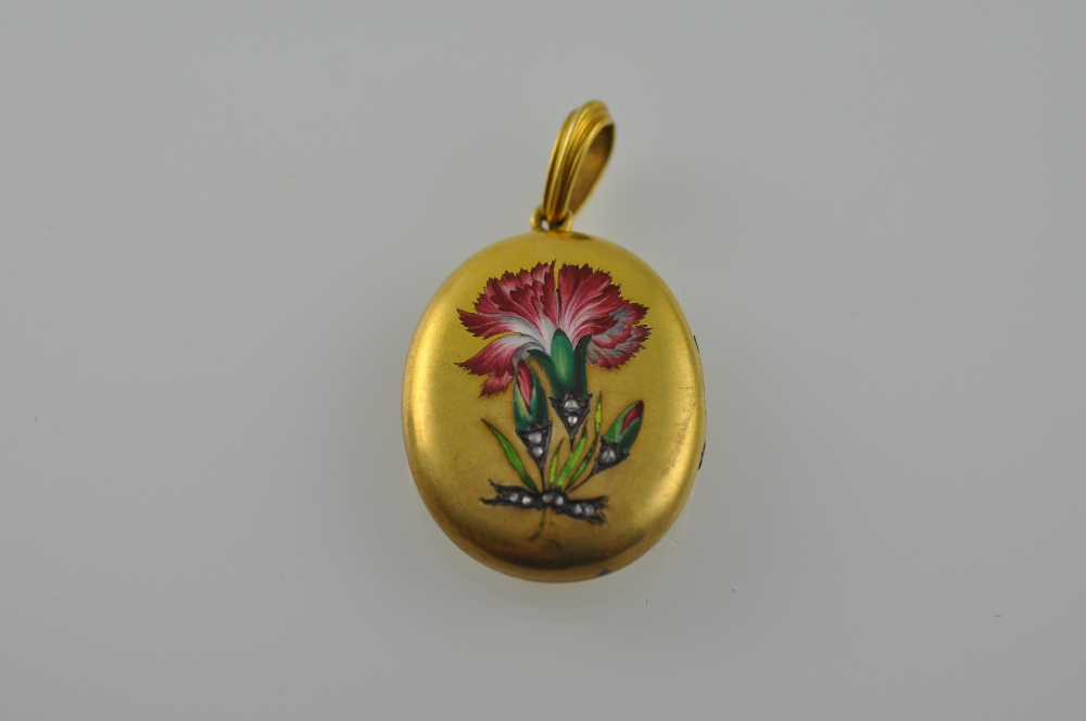 A yellow metal and enamel locket, oval on a shaped bale, decorated with a carnation set with