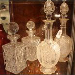 A pair of Victorian cut glass mallet shaped decanters and stoppers together with a pair of spirit