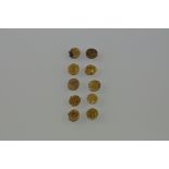 A quantity of 10 Persian hammered yellow metal coins, possibly high carat, 3.5g.