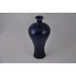 A baluster shaped blue glazed vase, with four character mark to base, H. 17cm.