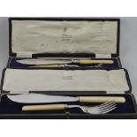 A pair of silver plated fish servers in fitted case; together with another similar pair.