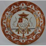 A 19th century Chinese armorial charger, possibly Portuguese, decorated with diaper and fish-scale