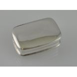 A plain rectangular white metal pill box, with domed cover, stamped 925.