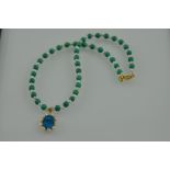 A turquoise bead and pearl necklace, with an oval pendant drop, L. 43cm.