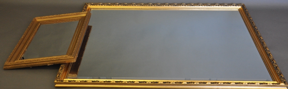 A large rectangular gilt framed mirror, the foliate frame with a bevelled plate, W. 98cm; together