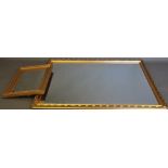 A large rectangular gilt framed mirror, the foliate frame with a bevelled plate, W. 98cm; together