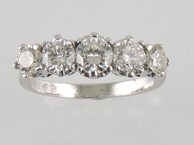 An 18ct white gold five-stone diamond ring, total weight 1.62ct, size N.