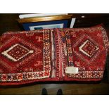 A pair of Middle Eastern woolen Camel bags, having geometric central medallions.