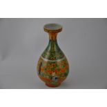 A baluster shaped vase, the yellow and green glaze depicting a narrative scene, H. 21cm.