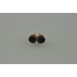 A pair of amethyst ear studs, the claw set stones in 9ct gold, 4g.