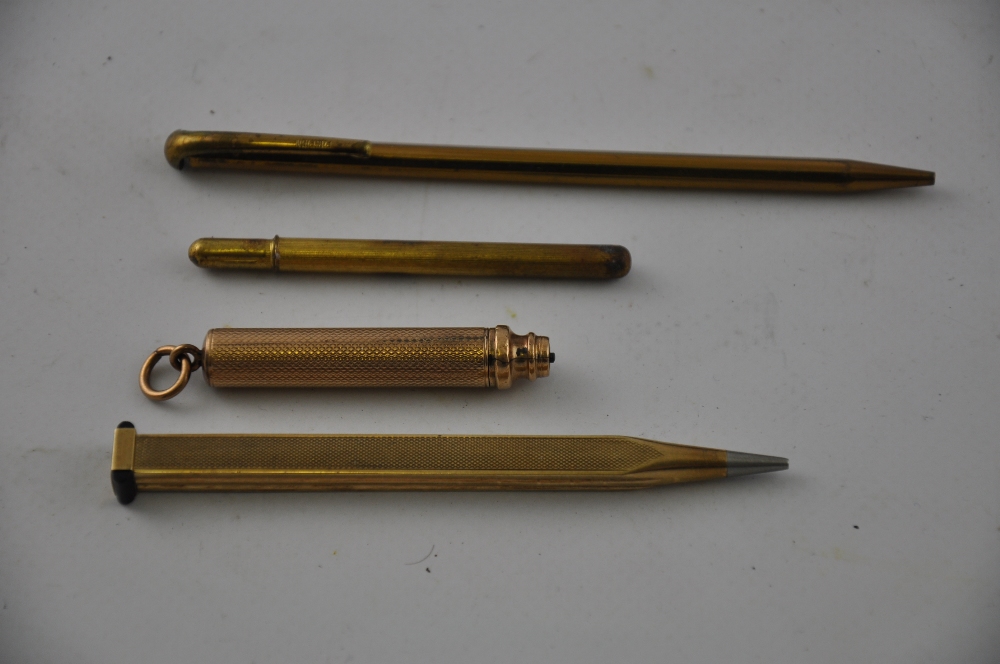 An Art Deco yellow metal pencil, marked 9ct Foreign', with alternating panels of fluted and