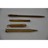 An Art Deco yellow metal pencil, marked 9ct Foreign', with alternating panels of fluted and
