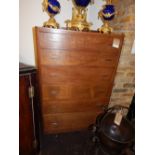 An Art Deco period lace wood (oak) chest, fitted 6 graduated long drawers raised on a plinth base.