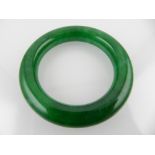 A spinach green hardstone bangle.