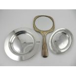 A silver hand mirror, hallmarked Birmingham 1923, together a French silver dish and one other white