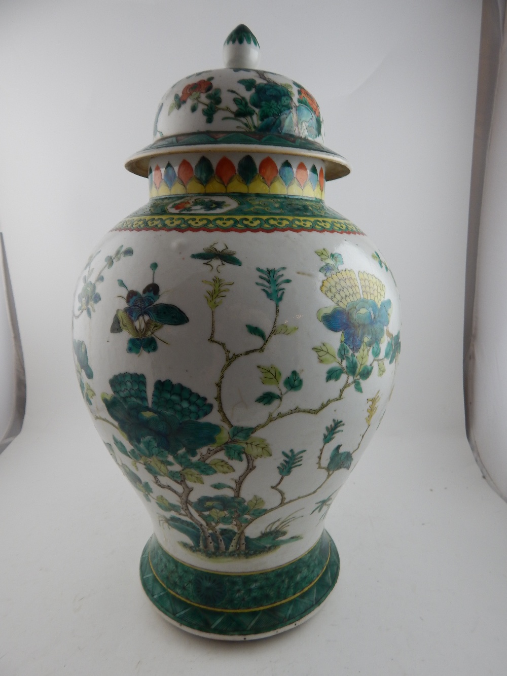 A 19th century Chinese inverted baluster vase and cover, decorated in the famille vert palette