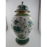 A 19th century Chinese inverted baluster vase and cover, decorated in the famille vert palette